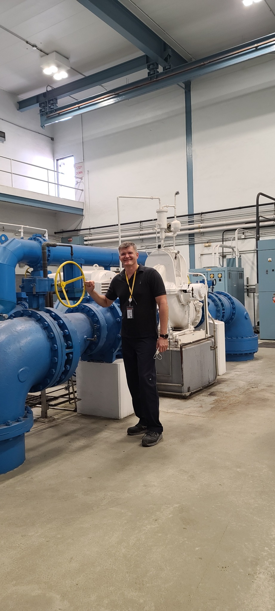 Gregory Jasiurkowski with large-scale industrial piping and equipment systems
